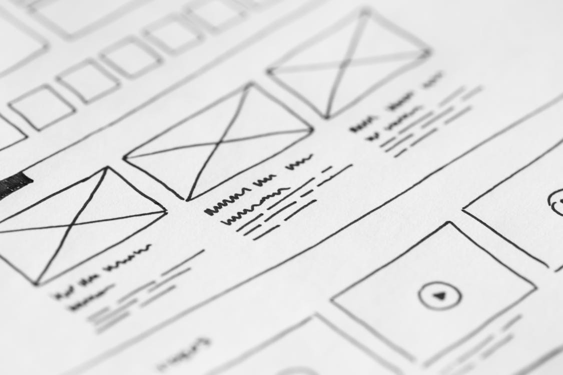 Website Design Checklist 2026: 32 Steps for a Flawless Launch 6 Hand-drawn wireframe for website layout with placeholders for images and videos.
