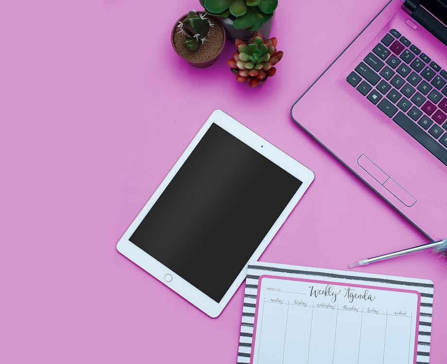 Website Design Checklist 2026: 32 Steps for a Flawless Launch 4 Website design mockup on tablet and laptop with a light pink background, plants, and a pen